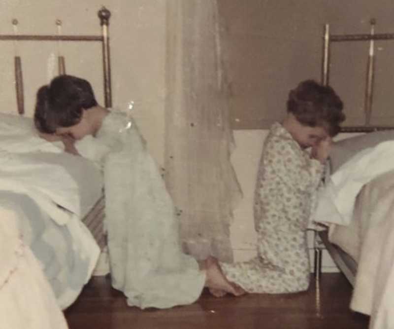 This October 1968 family photo shows Katie Bowman as a child, right, in her room in Waterloo, Iowa. Bowman’s parents welcomed into their religious home three priests who molested her, she said, starting when she was around 4, a few months after this photo was made. (Courtesy of Katie Bowman via AP)